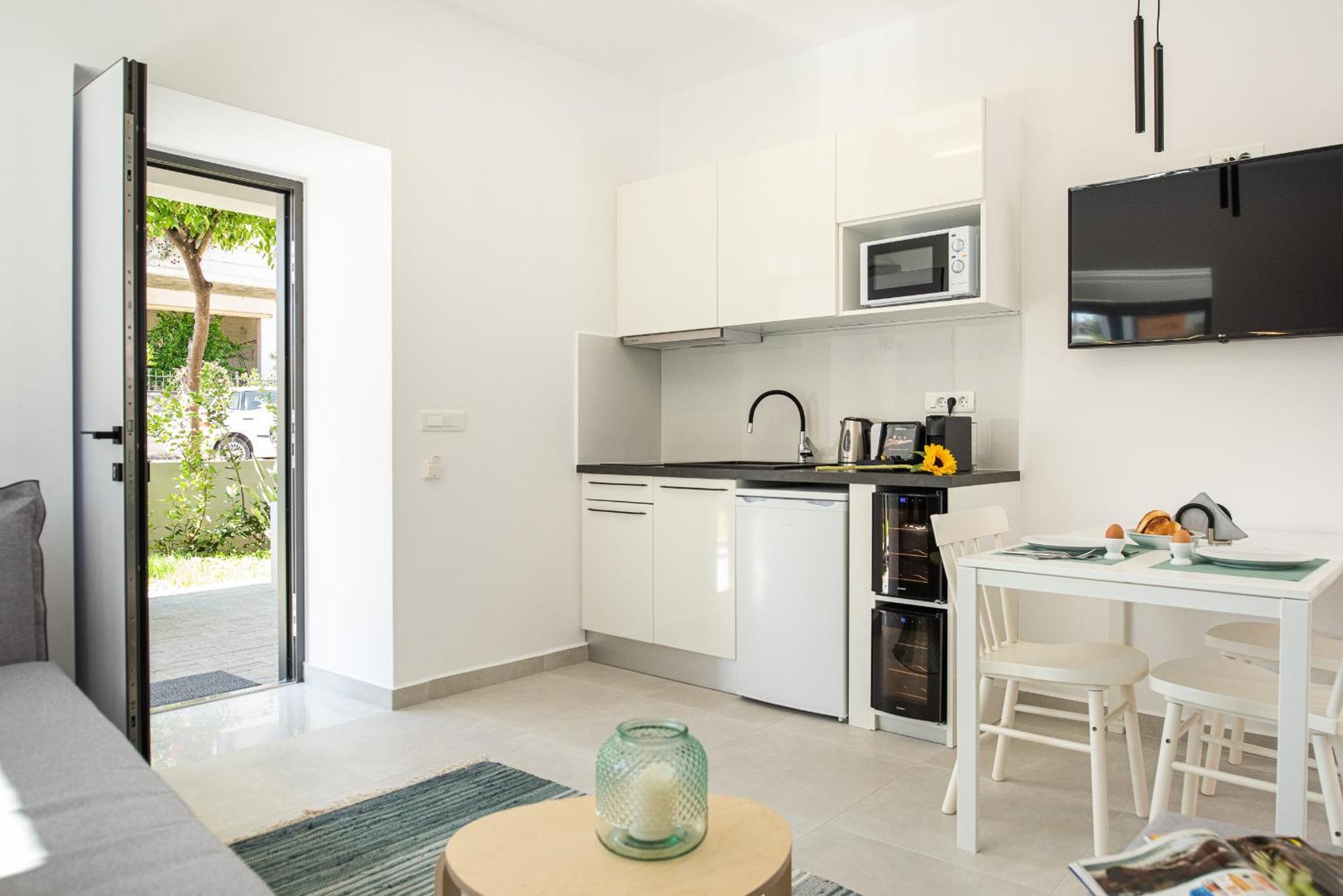 Cozy Corner Luxury Apartments Chrissi Akti Chania Quarto foto
